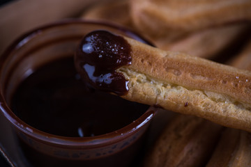 Street food latin churros with chocolate dip