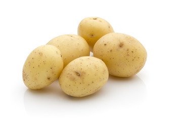 Potatoes on the white background.  New harvest.