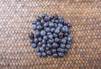 Blueberry fruits on wicker background