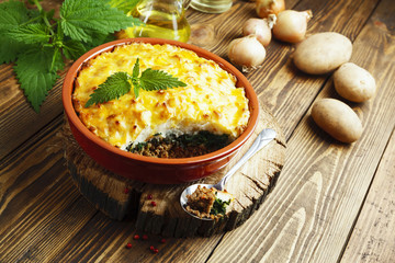 Potato casserole with meat and nettle