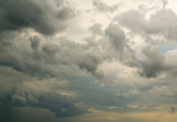 Fototapeta na wymiar Fluffy Rain Clouds Against Cloud Filled Sky