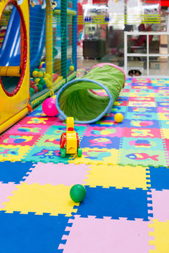 Childrens Play Toys On Bright Soft Tiles