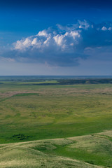 Fototapeta na wymiar Big Rain Clouds Gather Over a Prairie