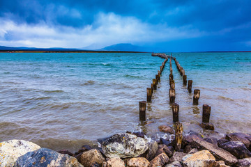From the water stick piles of destroyed pier