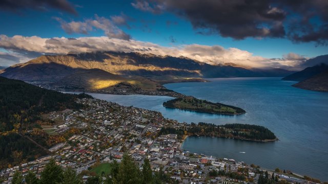 Day to Night Sunset Time Lapse over Queenstown, New Zealand. High Angle View