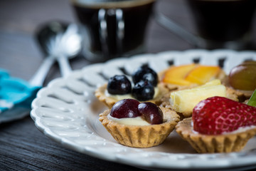 artisan dessert,mini tartlets with fresh fruits and coffee