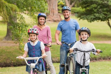 Happy family on their bike at the park 