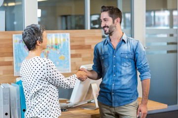 Smiling business people shaking hands