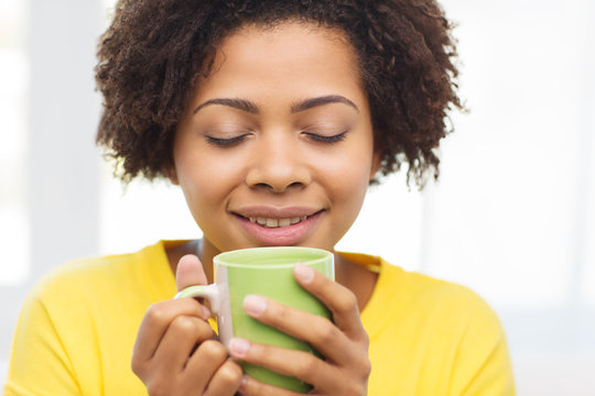 Happy African American Woman Drinking From Tea Cup