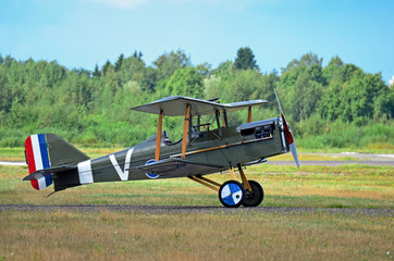 Vintage airplane on grass field © citikka