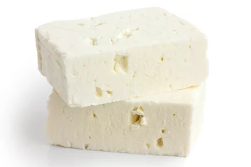 Fototapeten Greek feta cheese block isolated on white. © Moving Moment