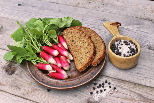 Fresh organic radish with bread and salt