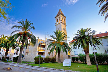 Fototapeta na wymiar Teogir stone church and palms