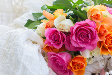 pink and orange roses with lace
