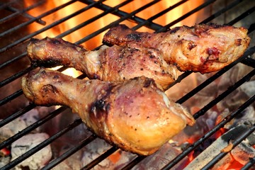 Close-up Of BBQ Chicken Legs On The Hot Flaming Grill