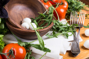 background from mixed vegetables with wood bowl