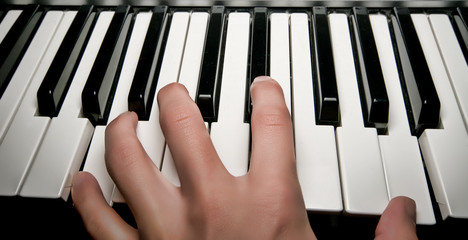 Hand playing piano