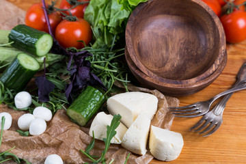 background from mixed vegetables with wood bowl