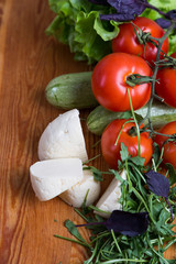 background from mixed vegetables with wood board