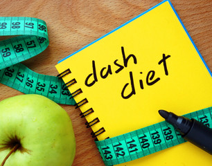Notepad with dash diet, apple and measure tape