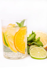 fresh cold cocktail in glass with sliced citus