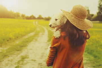 girl holding her dog