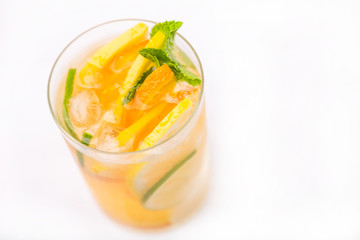 fresh cold cocktail in glass with sliced citus
