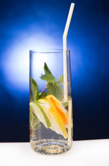 fresh cold cocktail in glass with sliced citus