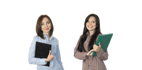 Two cute girls keeping large note pads.
Female students cheerful and smiling jeans casual style dress code keeping large black and green notepads and cell phone on white background