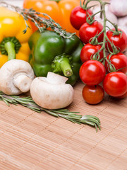 group fresh colored vegetables on wooden