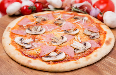 hot pizza with garnish and components