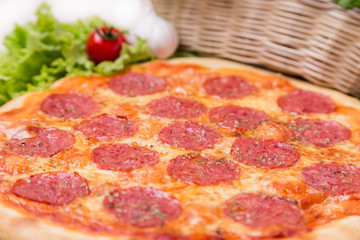 hot pizza with garnish and components