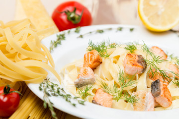 hot pasta with garnish on plate