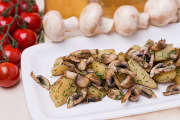hot potato and mushroom with garnish on white plate