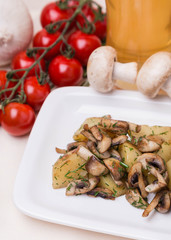 hot potato and mushroom with garnish on white plate