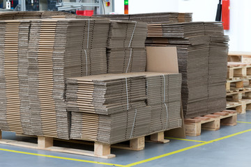 Large number of folded cardboard boxes