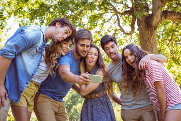 Happy friends taking a selfie 