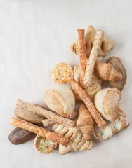 Fotobehang various small baked bread and buns © sytnik