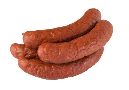 pile meat flavour sausages on white