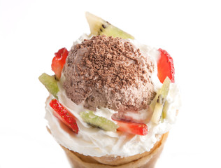 Rolled of cone pancakes with ice-cream and fruits