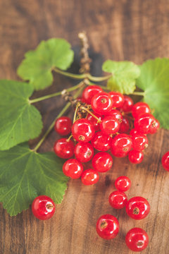 red currants on wooden surface slightly retro graded
