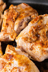 cook chicken  with spice on frying pan