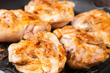 cook chicken  with spice on frying pan