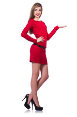 Young blonde girl in red short  dress holding isolated on white