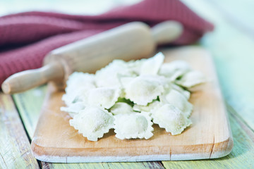 flour and raw ravioli