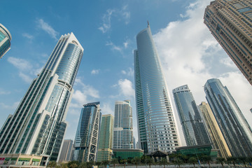 Obraz na płótnie Canvas Tall skyscrapers in Dubai near water