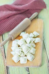 flour and raw ravioli