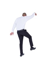 Businessman walking with arms up 