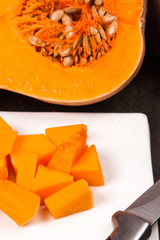 half fresh orange pumpkin with slice pieces
