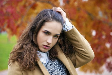 Portrait of young Italians in beige coat